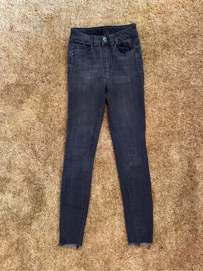 Black high-waisted Rue 21 skinny jeans with frayed hem; good condition